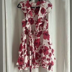 Free People. Wrap mini dress. White with pink flowers. Size small.